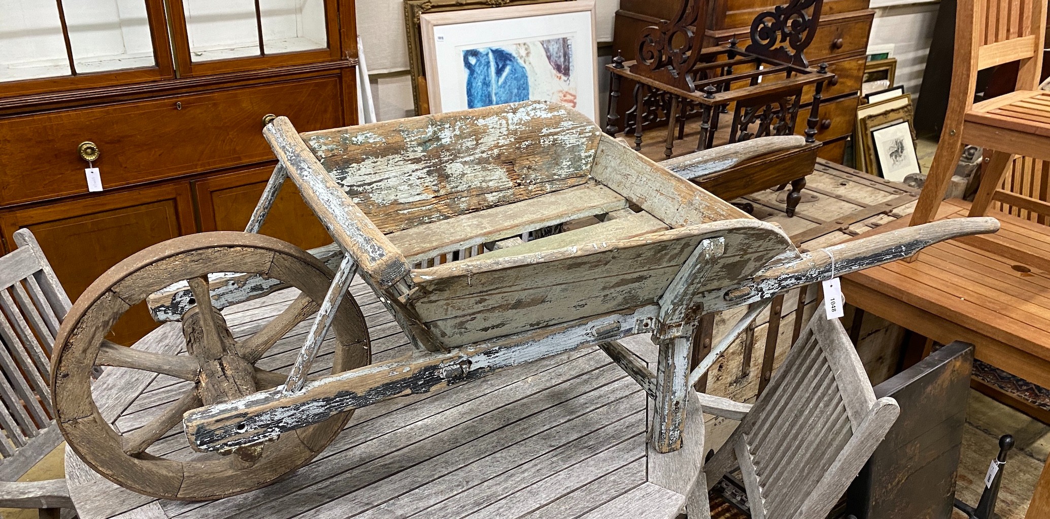 A rustic wooden pine wheelbarrow, length 170cm